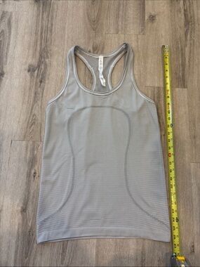 lululemon athletica Run swiftly racerback tank size 8. White/blk stripe